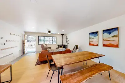 a living room with a table and a couch at Piney Point in Arnold