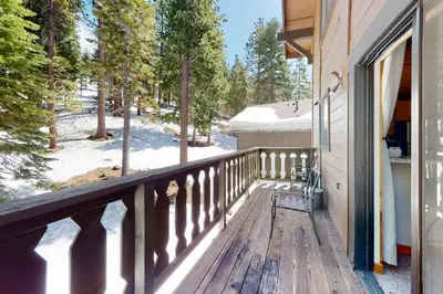 a balcony of a house with snow on the ground at Beaver Lodge in South Lake Tahoe