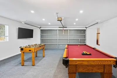 a room with a pool table and a flat screen tv at Country Club Hideout - w/ HotTub, King bed in Oakhurst