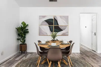 a dining room with a table and chairs at Country Club Hideout - w/ HotTub, King bed in Oakhurst