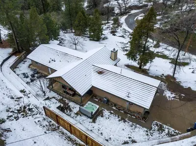 an overhead view of a building covered in snow at Country Club Hideout - w/ HotTub, King bed in Oakhurst