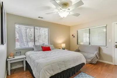 a bedroom with a bed and a ceiling fan at Oakhurst Vacation Rental Near Hiking and Bass Lake! in Oakhurst