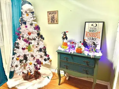 a christmas tree on a dresser next to a green dresser at Spacious Downtown Jackson Retreat- Historic Hangout in Jackson
